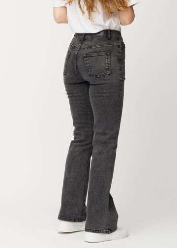 Mørkegrå mid-rise bootcut-jeans i fargen Shadows. Sett bakfra på en modell, slik at hele passformen vises.