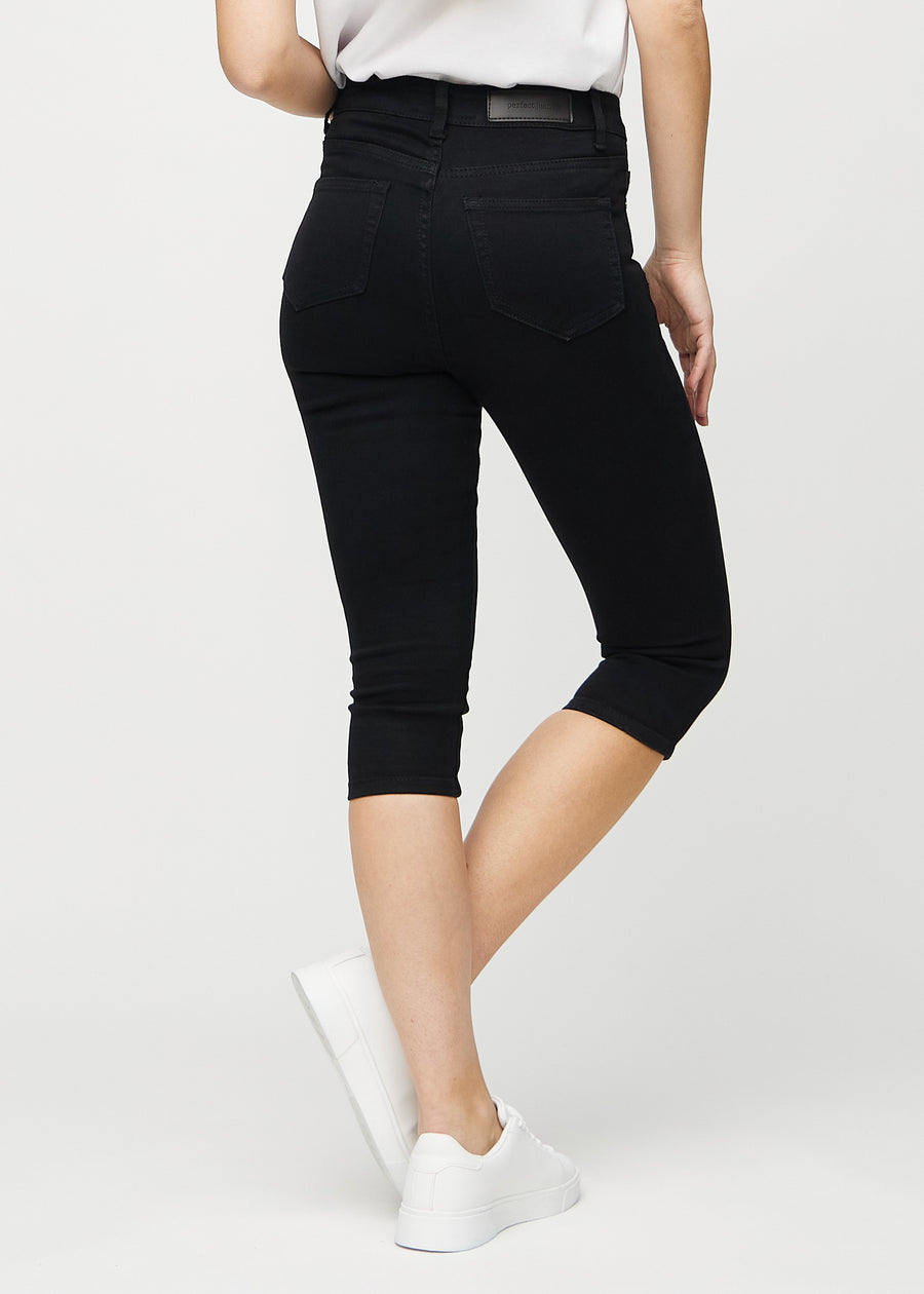 Svarte skinny capris sett bakfra, slik at man kan se hele produktet.