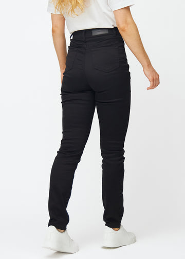 Svarte høytaljede slim jeans sett bakfra, slik at man kan se hele produktet.

