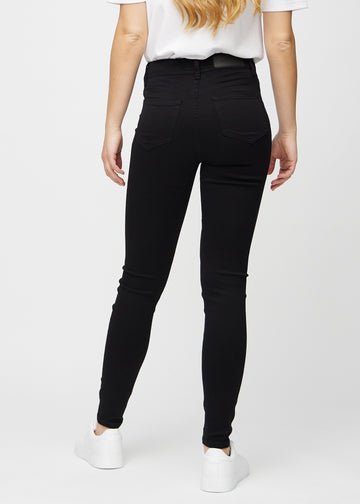 Svarte skinny jeans sett bakfra, så man kan se hele produktet.