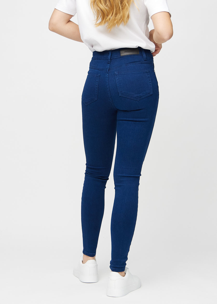 Mørkeblå skinny jeans sett bakfra, så man kan se hele produktet.