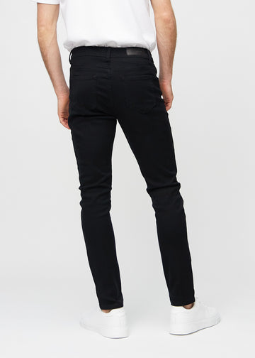 Svarte jeans i slim fit sett bakfra for å vise hele produktet.