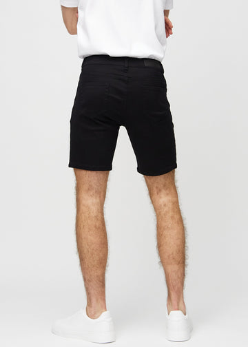 Svarte middle-slim shorts sett bakfra, så man kan se hele produktet.